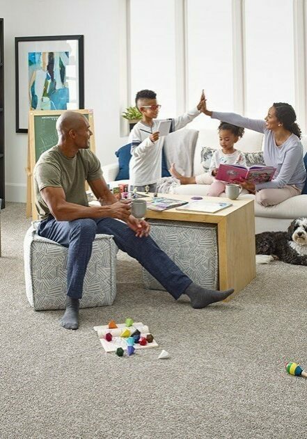 Family enjoying in living room | Drapery Affair